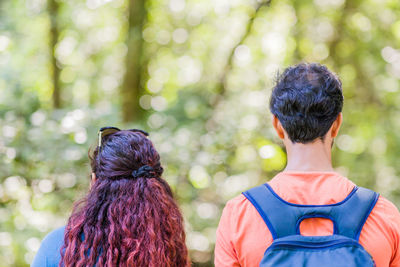 Rear view of woman standing outdoors