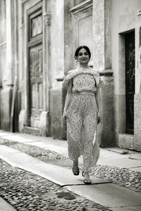 Rear view of woman walking on street