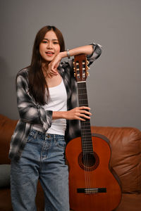 Young woman playing guitar