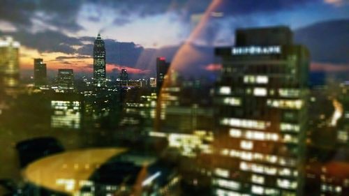 Illuminated buildings in city at night