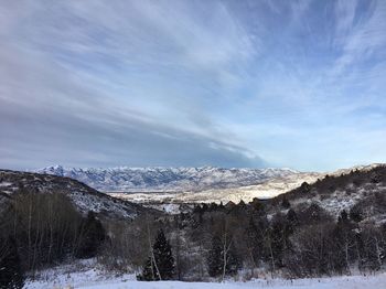 Scenic view of snowcapped mountains against sky