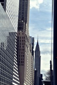 Low angle view of modern buildings against sky