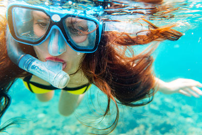 Woman snorkeling in sea