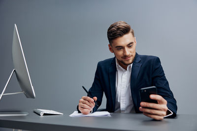 Young man working at desk in office