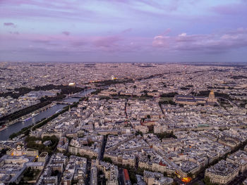 Aerial view of cityscape against sky during sunset