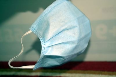 Close-up of white umbrella on table