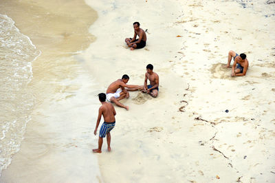 High angle view of men on beach