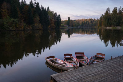 Scenic view of pier and lake against sky