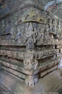 Close-up of buddha statue against wall