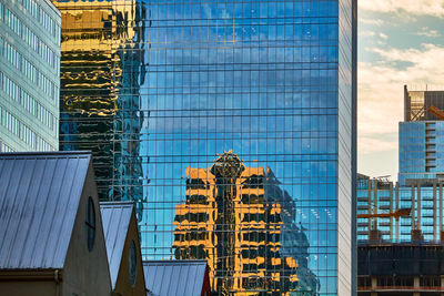 Low angle view of skyscrapers against sky