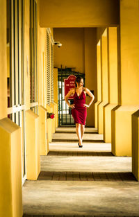 Woman walking on staircase in building