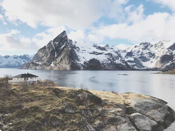 Scenic view of lake against cloudy sky