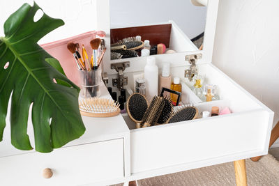 Stylish room interior with elegant dressing table and plants