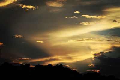 Low angle view of dramatic sky during sunset