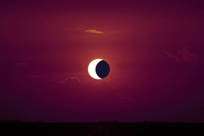 Scenic view of moon against sky at sunset