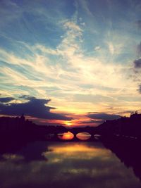 Scenic view of river at sunset