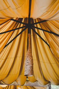 Pendant light hanging in tent