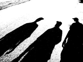 Silhouette people shadow against blurred background