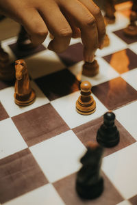 Low angle view of man playing with chess