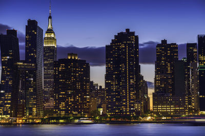 Illuminated buildings in city at night