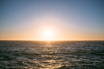 Scenic view of sea at sunset