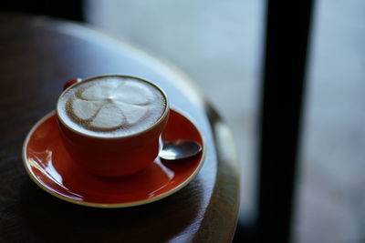 High angle view of coffee cup on table