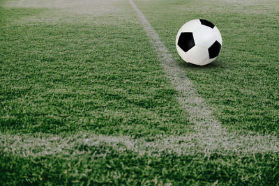 Close-up of soccer ball on field