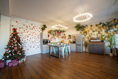 Empty chairs and tables on hardwood floor at home