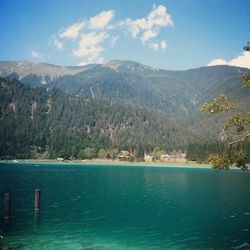 Scenic view of lake and mountains against sky