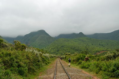 A railway line against a foggy mountain background, kijabe hills, rift valley, kenya