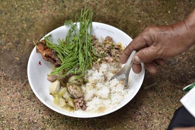 Cropped image of person eating food