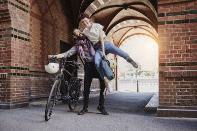 Happy couple with electric bicycle