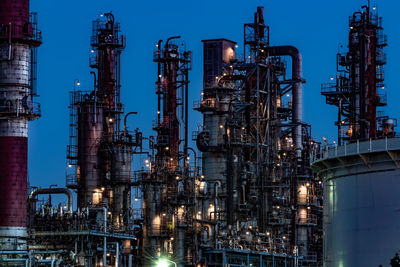 Factory against sky at night