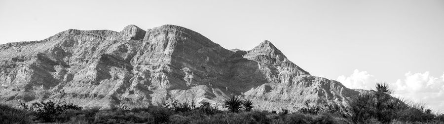 Panoramic view of mountains against clear sky