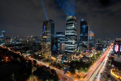 High angle view of illuminated buildings in city at night