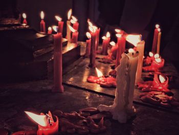 High angle view of illuminated candles on table