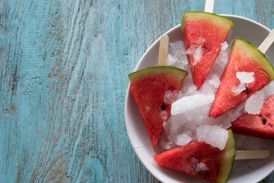 High angle view of fruits in plate on table