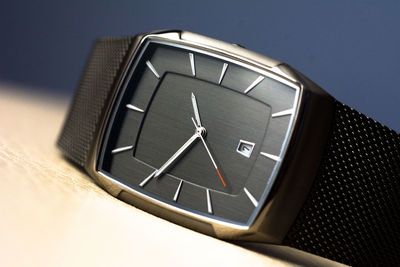 Close-up of clock over white background