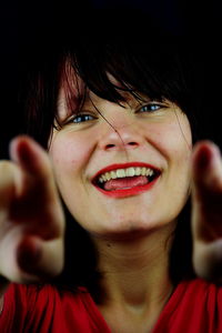 Close-up portrait of smiling young woman