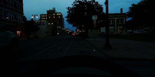 Cars on road in city at night