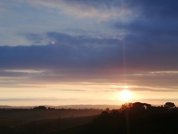 Scenic view of silhouette landscape against sky during sunset