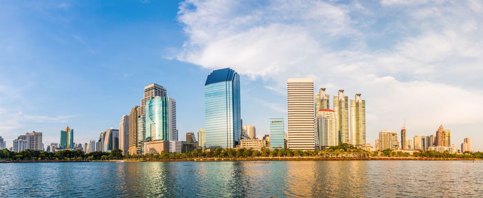 Panoramic view of modern buildings in city against sky