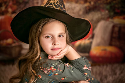 Portrait of a beautiful girl in a witch hat. going to the halloween party.