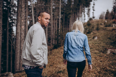 Full length of man standing in forest