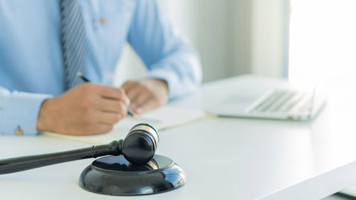 Close-up of man working on table