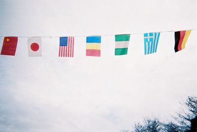 Low angle view of multi colored flags hanging