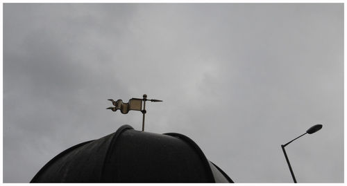 Low angle view of weather vane