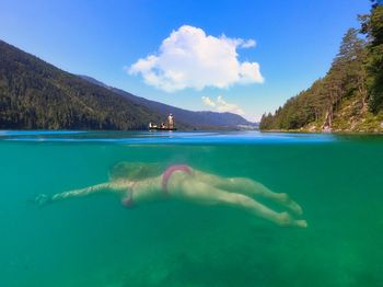 Swimming pool in sea against sky