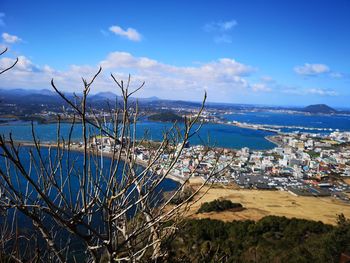 Scenic view of sea and buildings against sky