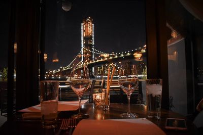 Illuminated glass of restaurant at night